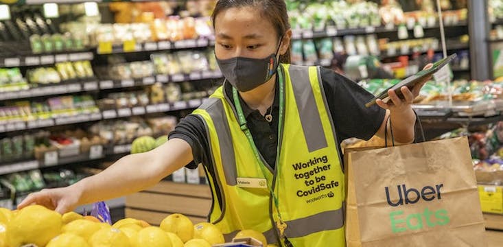 Coles and Woolworths race to keep up with grocery delivery boom with tech and automation processes